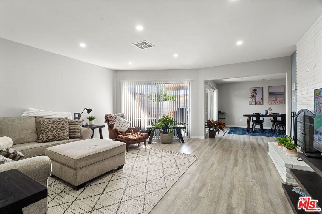 Dining room, Interior, Living room, Recessed Lighting, Stone Walls, Wood Texture Flooring