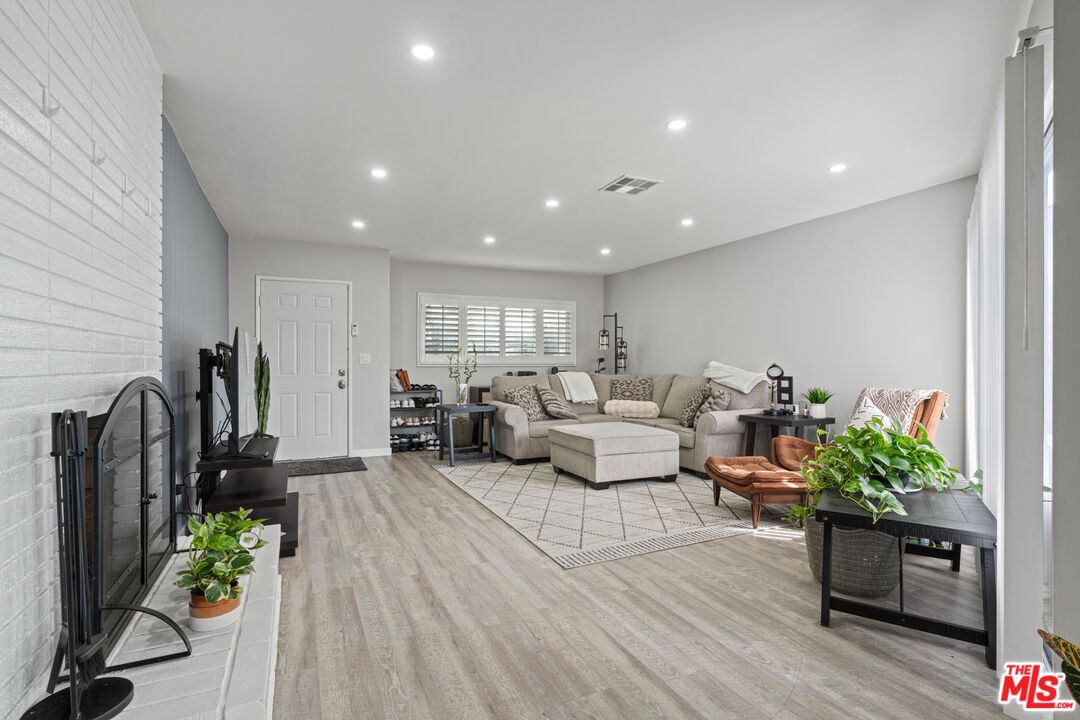 Fireplace, Interior, Living room, Recessed Lighting, Wood Texture Flooring