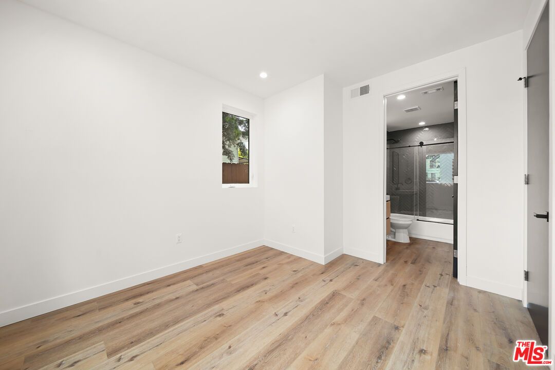 Bathroom, Empty room, Glass Shower, Interior, Recessed Lighting, Wood Texture Flooring