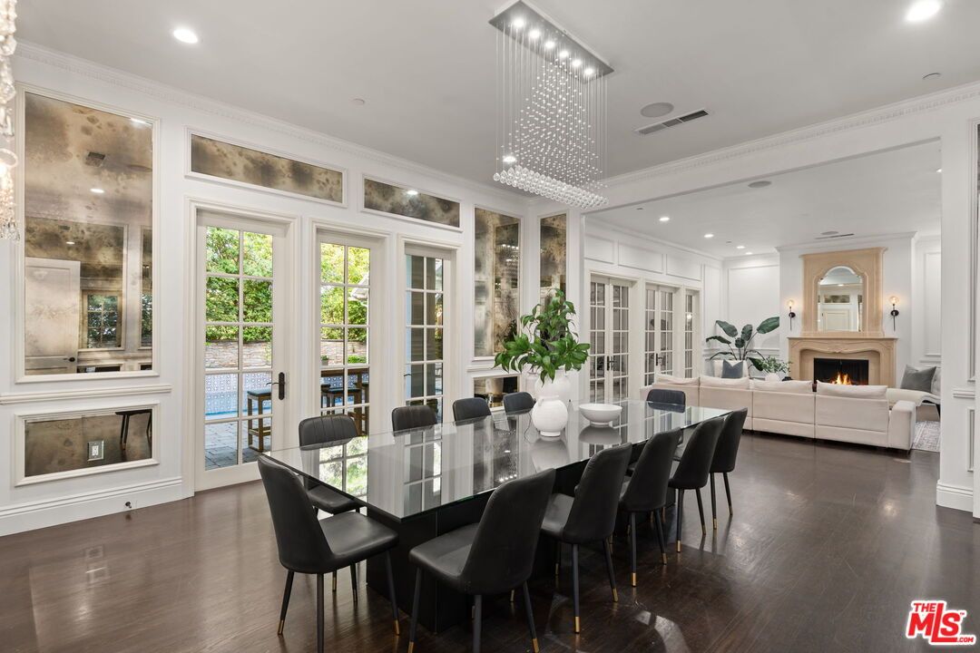 Chandelier, Dining room, Fireplace, Interior, Living room, Pendant Lights, Recessed Lighting, Wood Texture Flooring