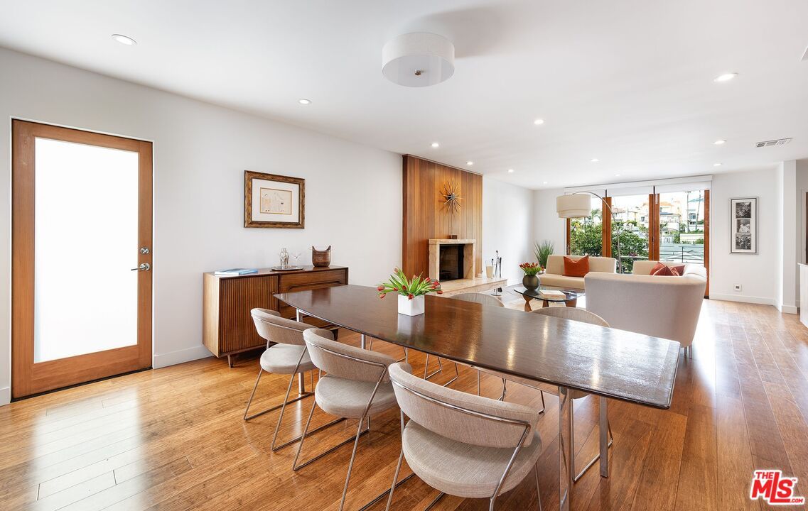 Dining room, Fireplace, Interior, Living room, Recessed Lighting, Wood Texture Flooring