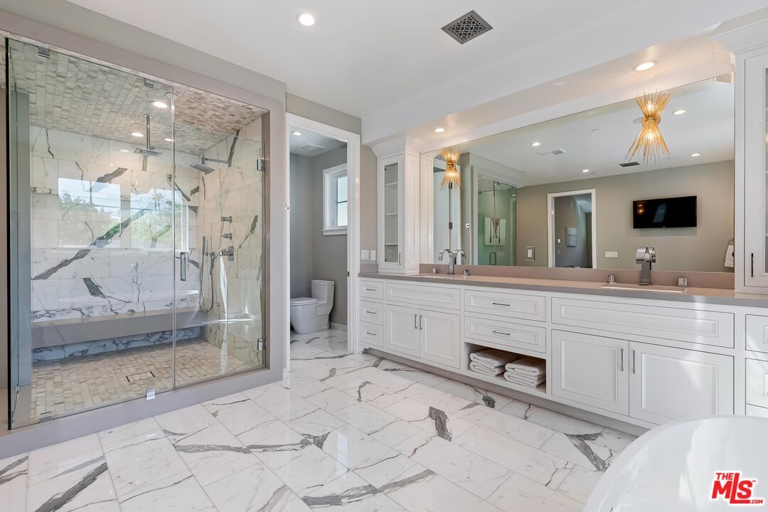 Bathroom, Dual Sink Vanities, Glass Shower, Interior, Marble, Marble Walls, Recessed Lighting