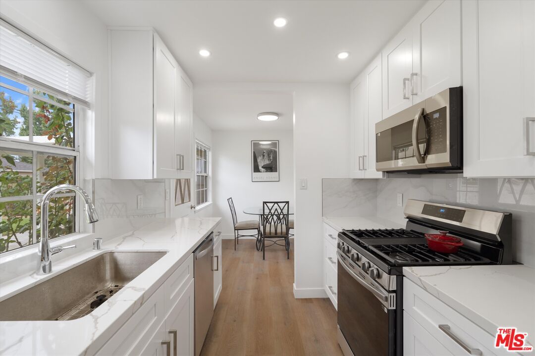 Dining room, Interior, Kitchen, Recessed Lighting, Stainless Steel Appliances, Wood Texture Flooring