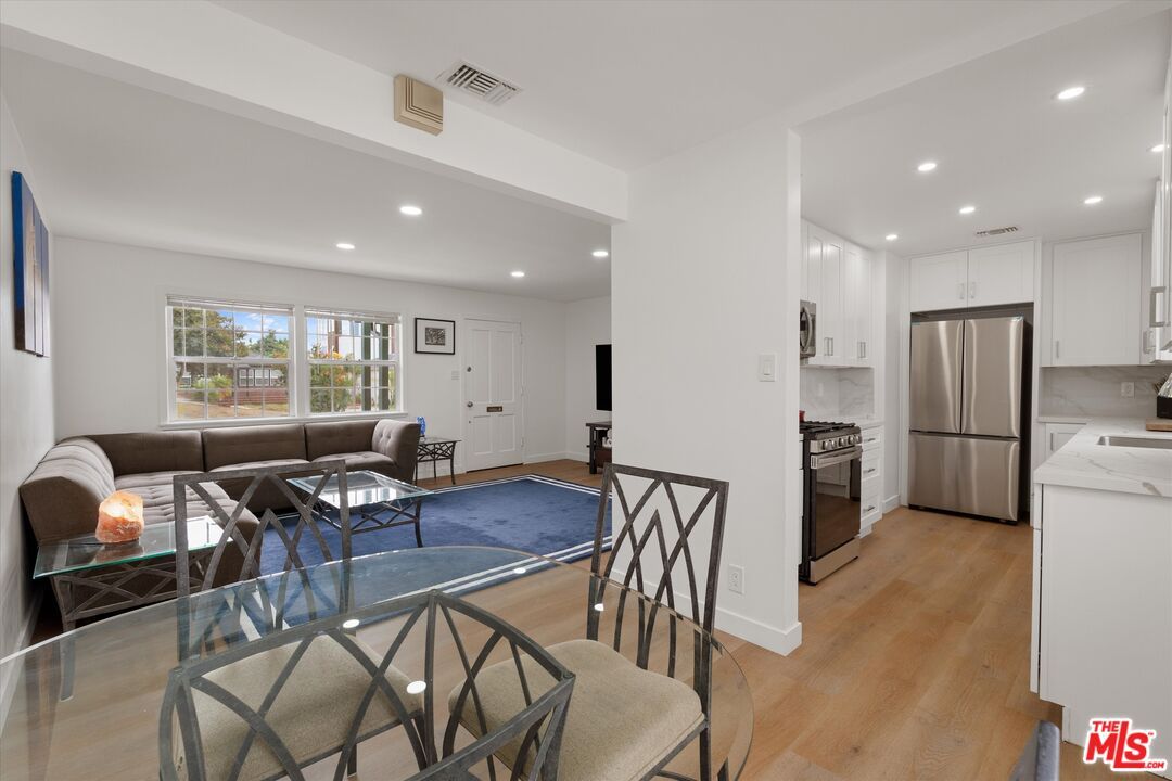 Dining room, Interior, Kitchen, Living room, Recessed Lighting, Stainless Steel Appliances, Wood Texture Flooring