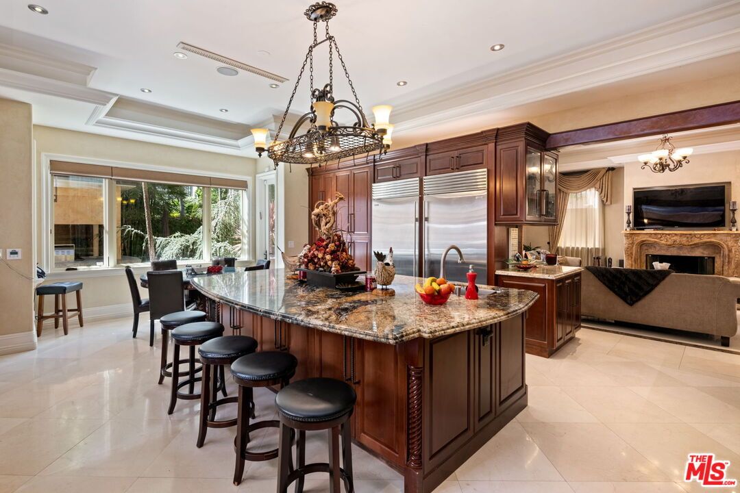 Chandelier, Dining room, Fireplace, Interior, Kitchen, Living room, Recessed Lighting, Stainless Steel Appliances