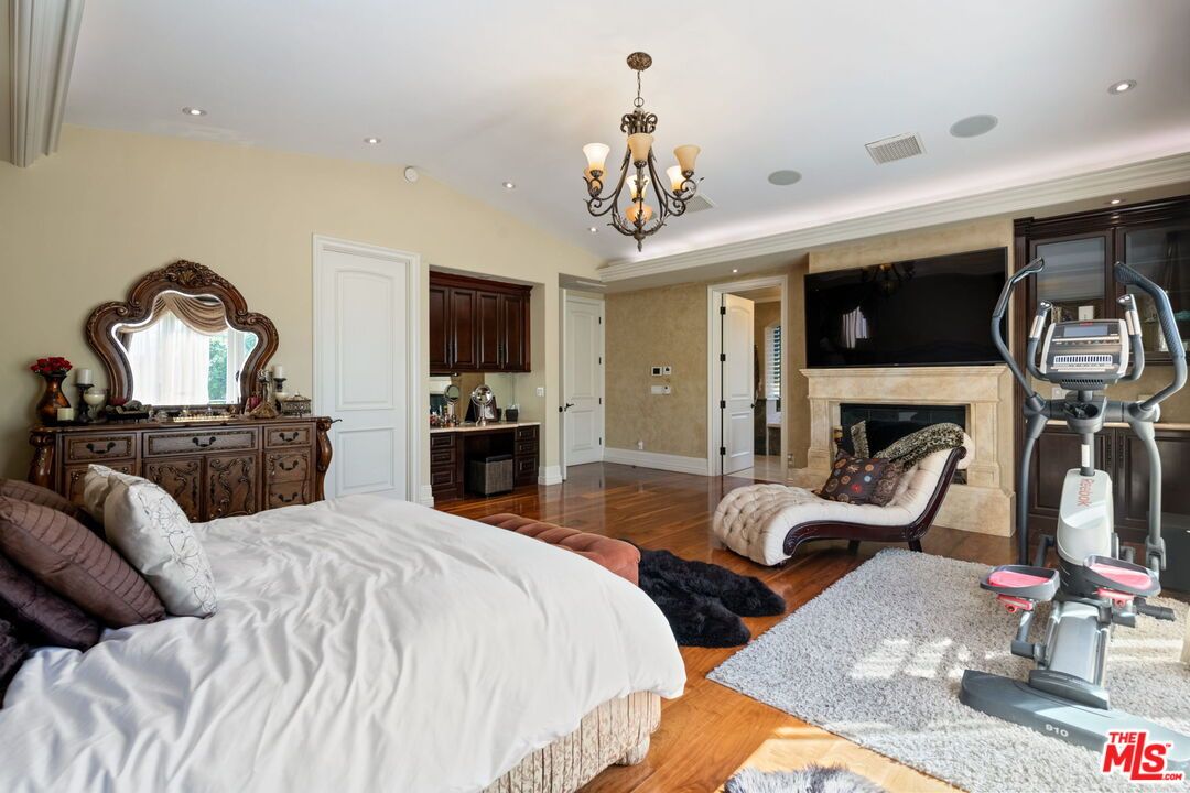 Bedroom, Chandelier, Fireplace, Interior, Recessed Lighting, Wood Texture Flooring