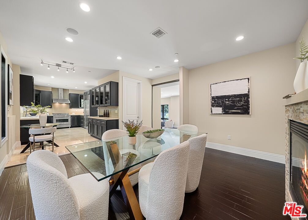 Dining room, Fireplace, Interior, Kitchen, Recessed Lighting, Wood Texture Flooring