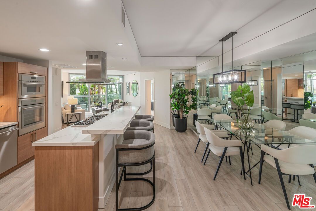 Dining room, Interior, Kitchen, Pendant Lights, Recessed Lighting, Stainless Steel Appliances, Wood Texture Flooring