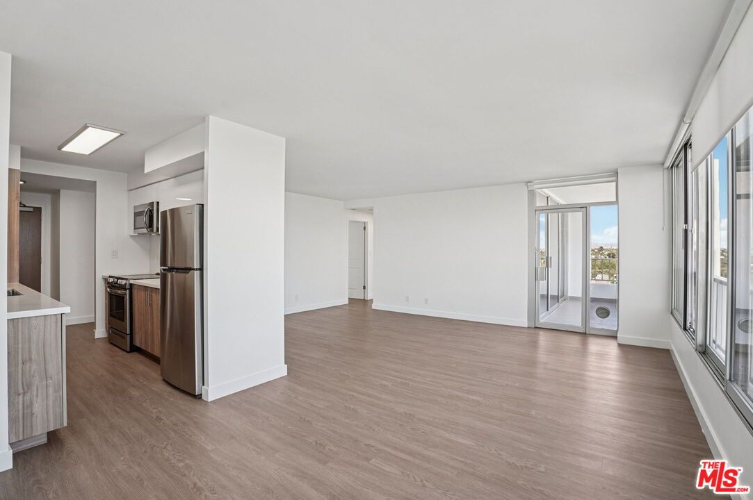 Empty room, Interior, Kitchen, Stainless Steel Appliances, Wood Texture Flooring