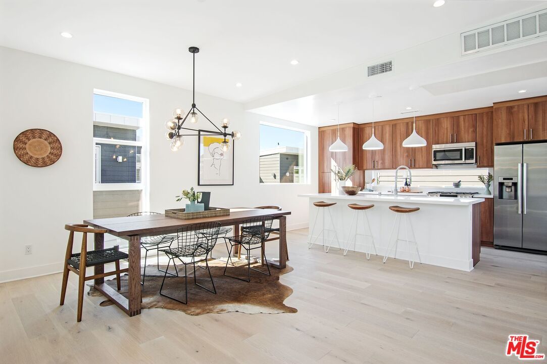 Dining room, Interior, Kitchen, Pendant Lights, Recessed Lighting, Stainless Steel Appliances, Wood Texture Flooring