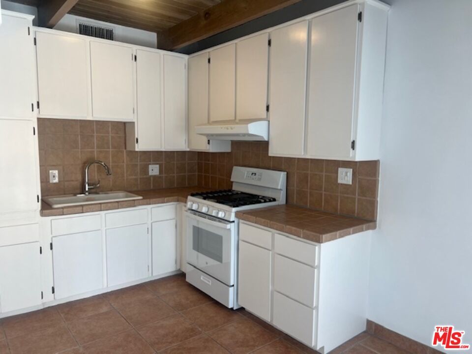 Interior, Kitchen, Recessed Lighting, Tile Countertops, Wooden Ceilings