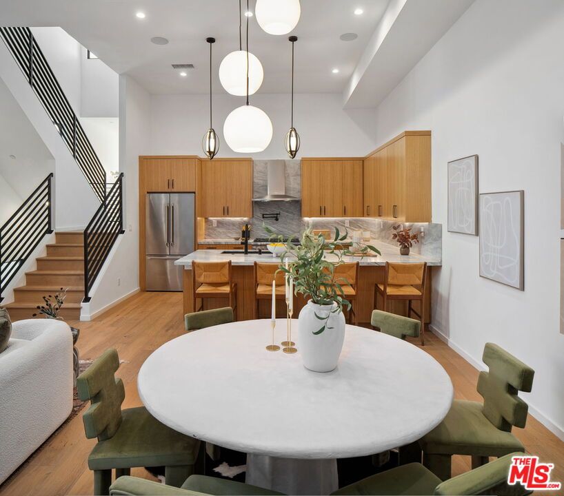 Dining room, Interior, Kitchen, Pendant Lights, Recessed Lighting, Stainless Steel Appliances, Wood Texture Flooring