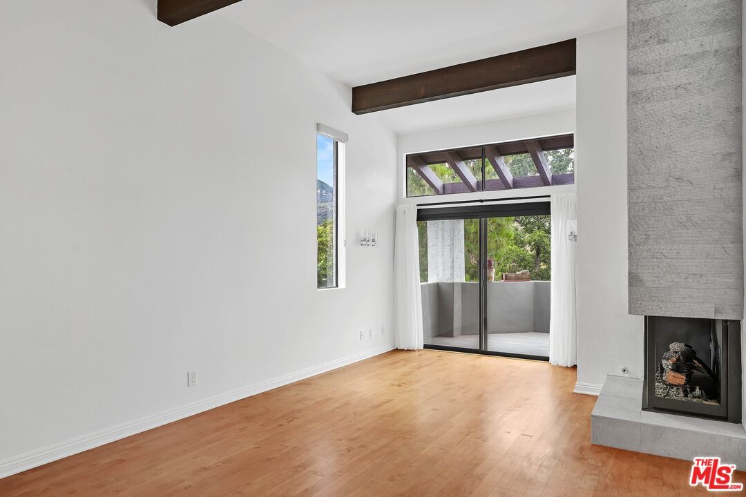 Empty room, Fireplace, Interior, Recessed Lighting, Wooden Beams, Wood Texture Flooring
