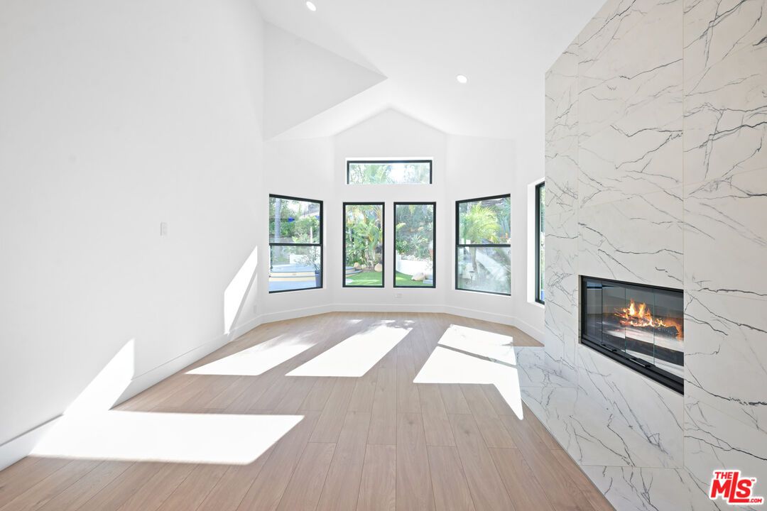 Empty room, Fireplace, Interior, Marble Walls, Recessed Lighting, Wood Texture Flooring