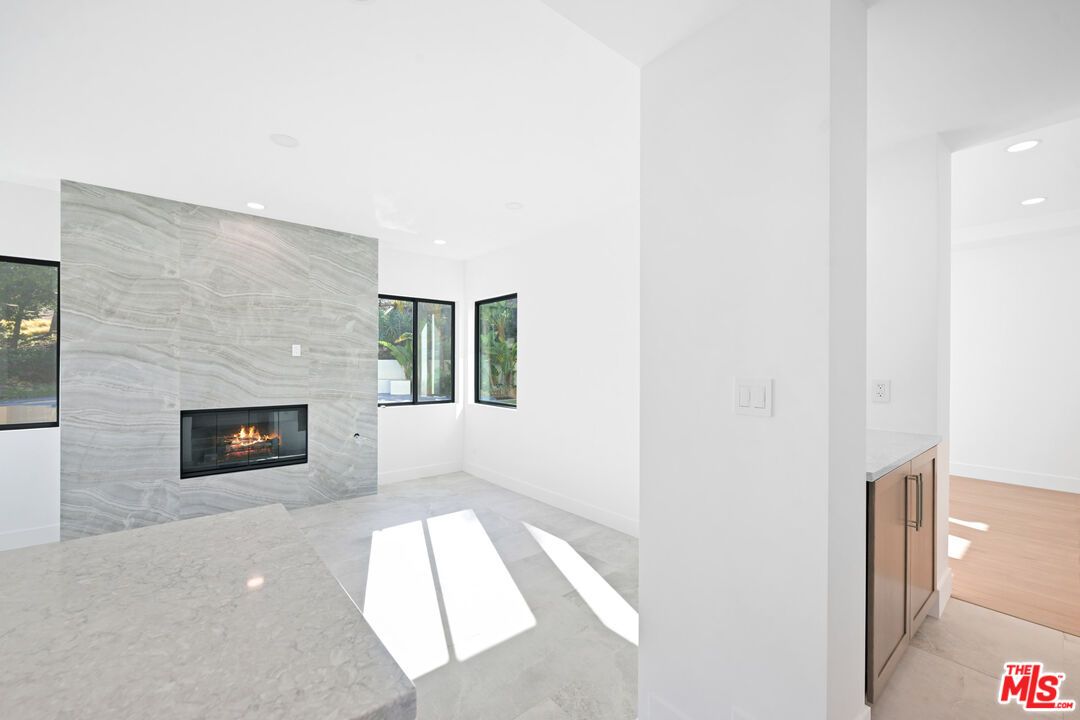 Fireplace, Interior, Marble Walls, Recessed Lighting, Wood Texture Flooring