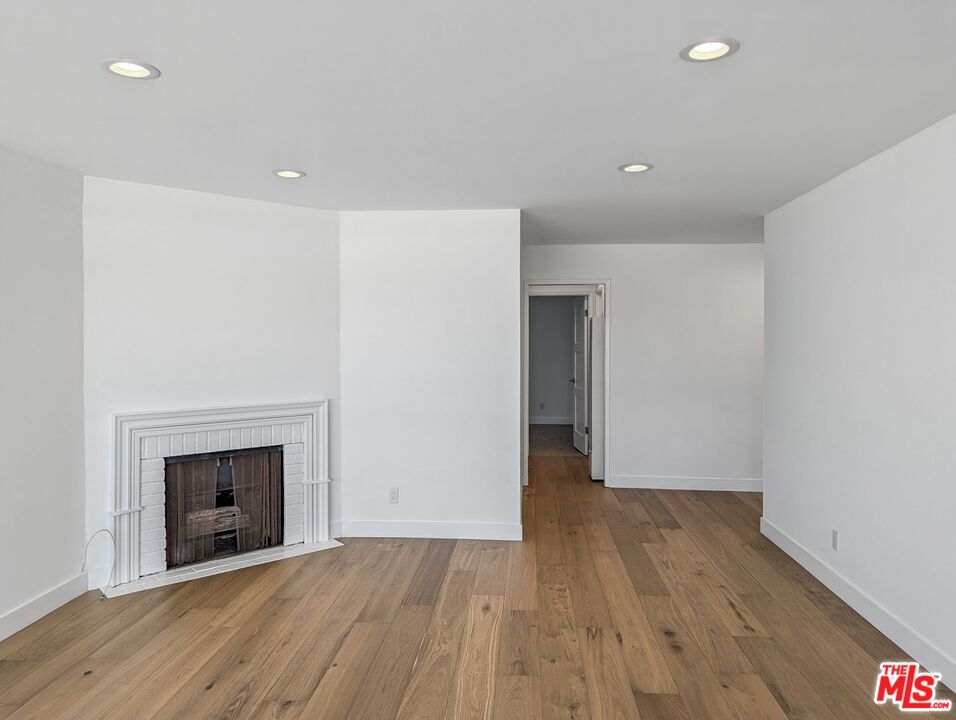 Empty room, Fireplace, Interior, Recessed Lighting, Wood Texture Flooring
