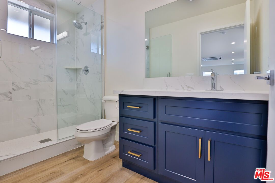 Bathroom, Glass Shower, Interior, Marble Walls, Recessed Lighting, Wood Texture Flooring