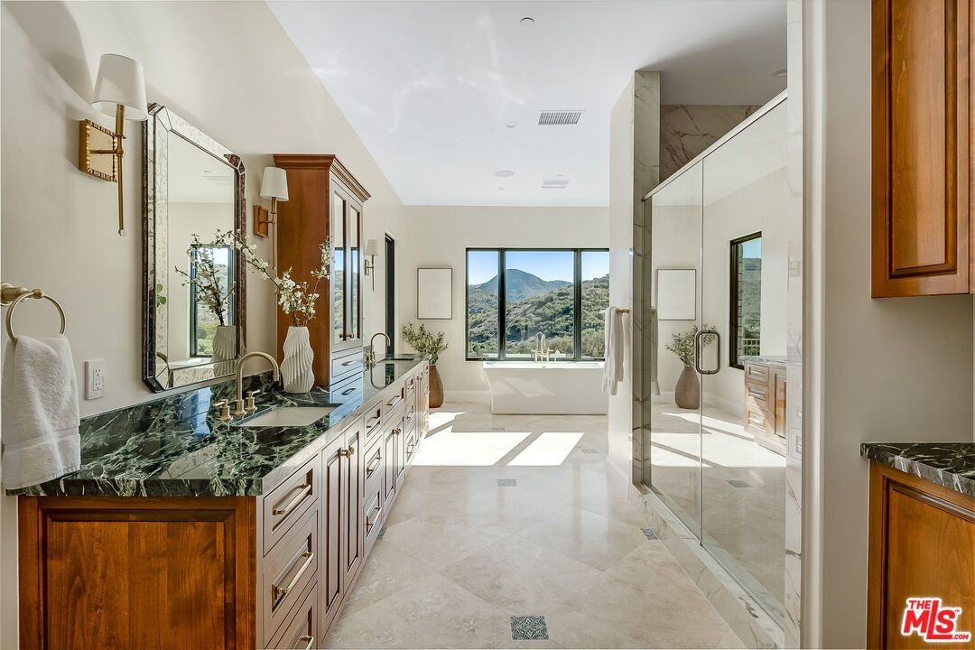 Bathroom, Dual Sink Vanities, Free Standing Baths, Glass Shower, Interior, Marble Walls, Recessed Lighting