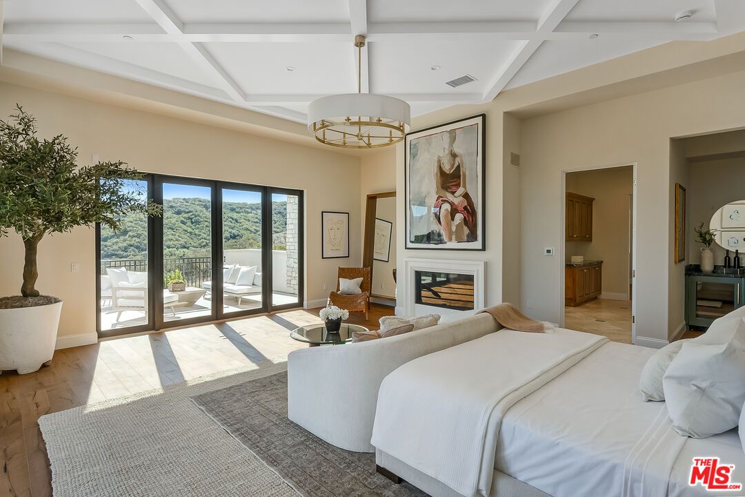 Bedroom, Chandelier, Fireplace, Interior, Recessed Lighting, Wood Texture Flooring