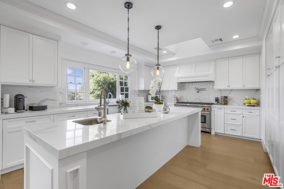 Interior, Kitchen, Marble Walls, Pendant Lights, Recessed Lighting, Stainless Steel Appliances, Wood Texture Flooring