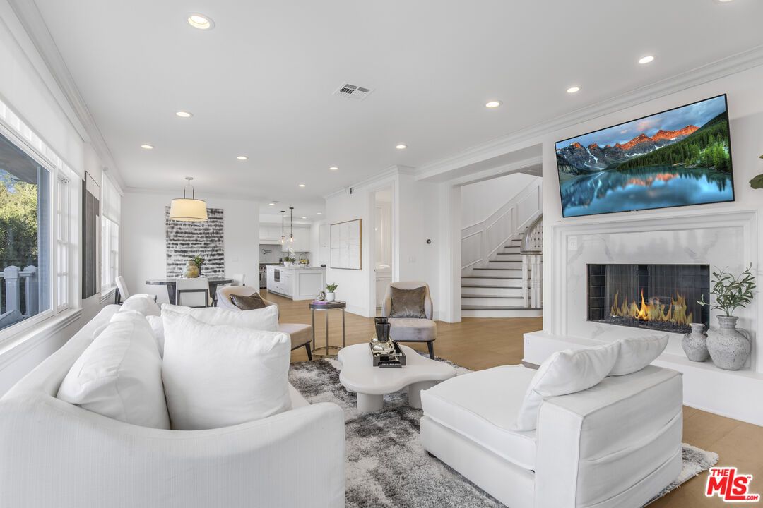 Dining room, Fireplace, Interior, Living room, Pendant Lights, Recessed Lighting, Wood Texture Flooring