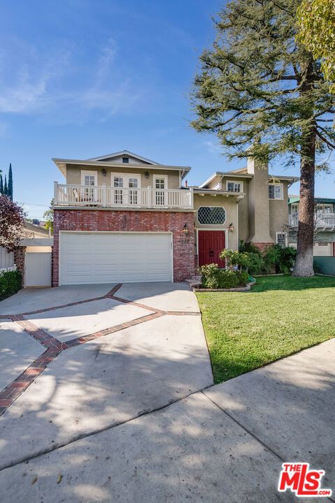 Attached, Backyard, Exterior, Facade, Brick Facade, Mediterranean