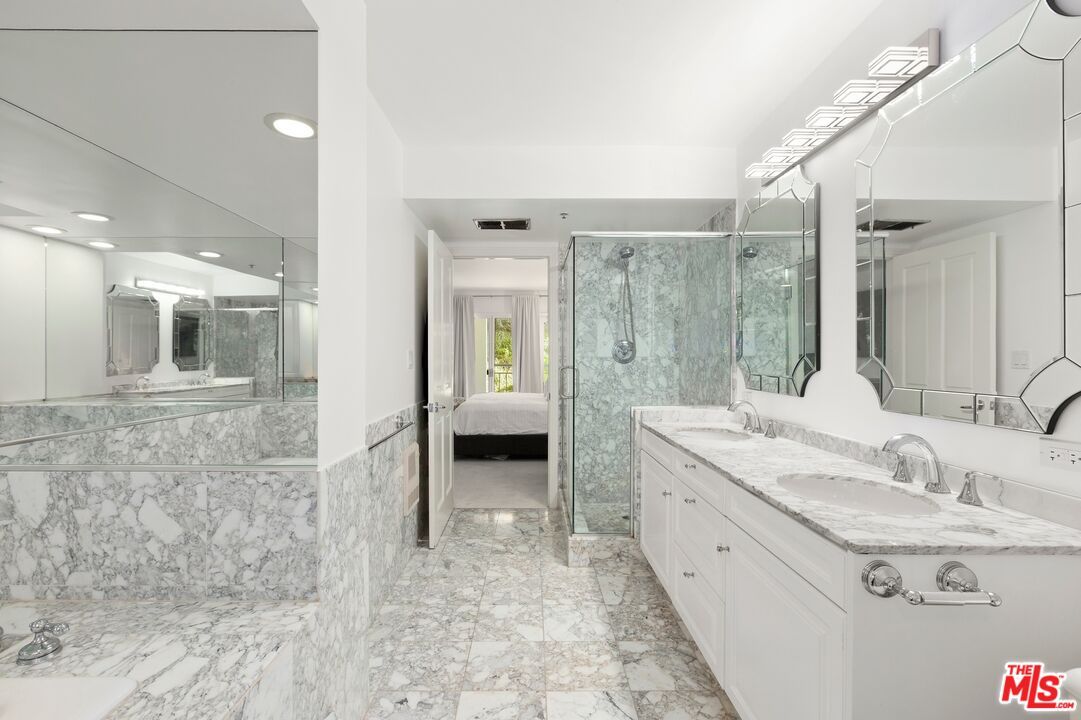 Bathroom, Dual Sink Vanities, Glass Shower, Interior, Marble, Marble Walls, Recessed Lighting