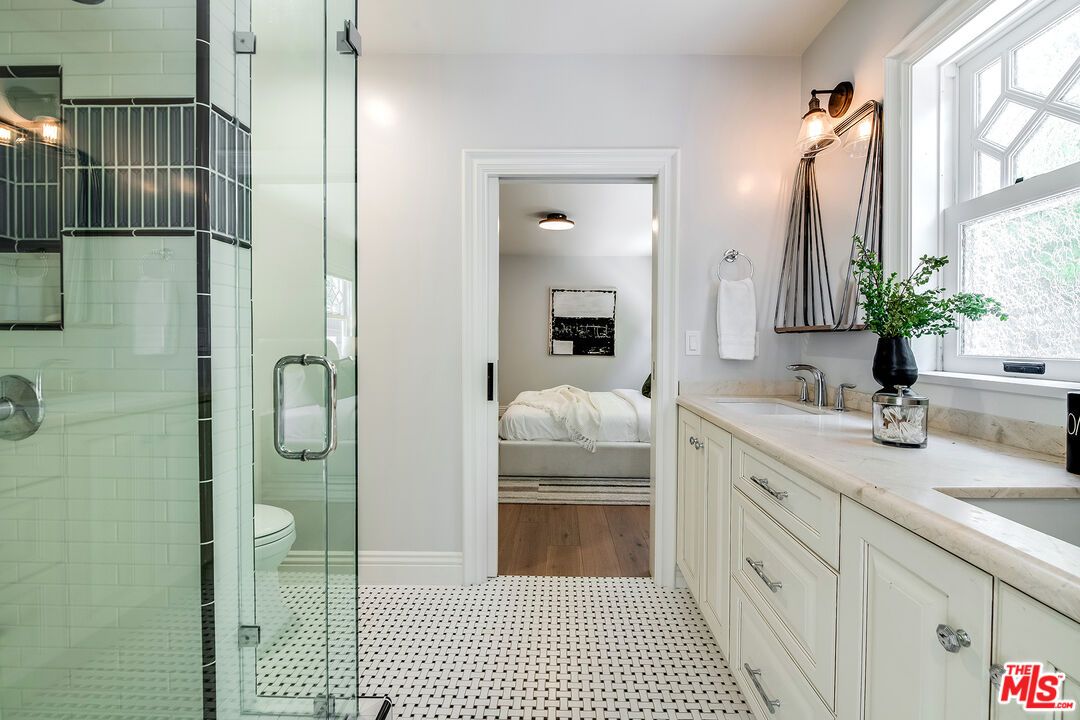 Bathroom, Bedroom, Dual Sink Vanities, Glass Shower, Interior, Wood Texture Flooring