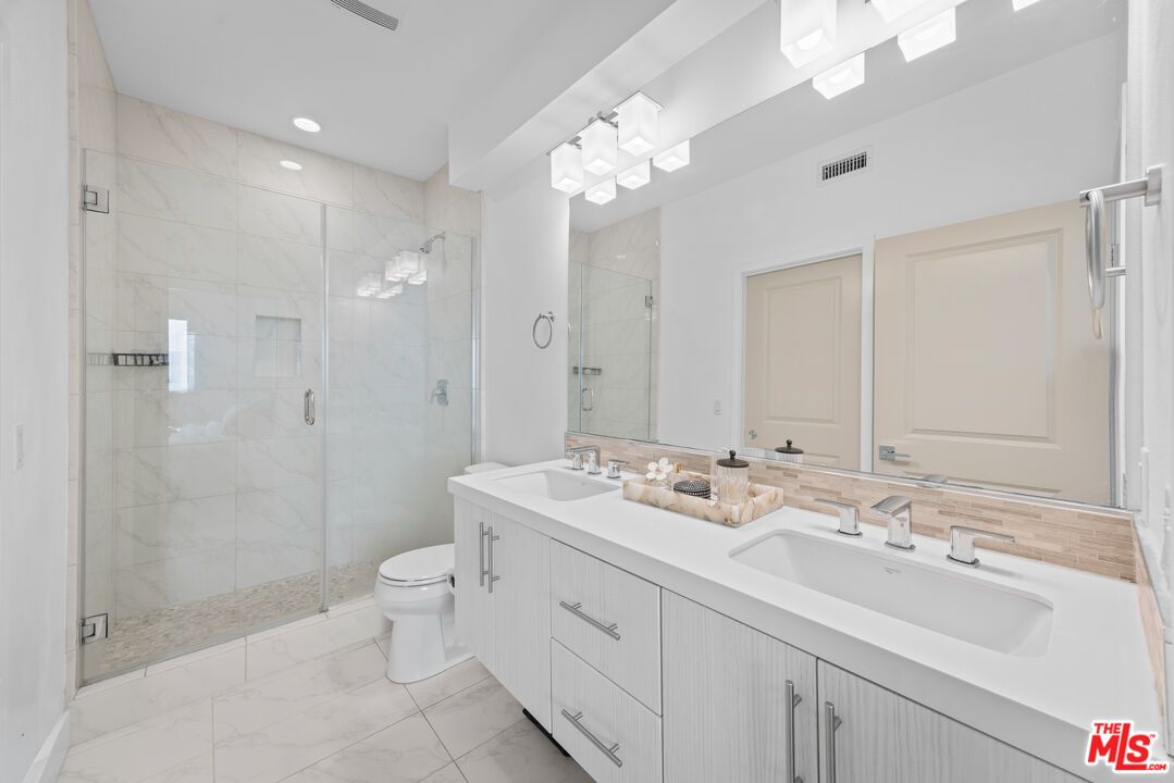 Bathroom, Dual Sink Vanities, Glass Shower, Interior, Marble, Marble Walls, Recessed Lighting