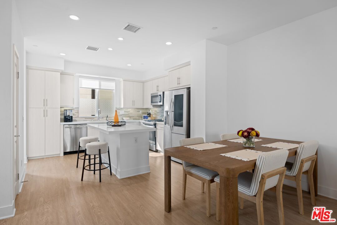 Dining room, Interior, Kitchen, Recessed Lighting, Stainless Steel Appliances, Wood Texture Flooring