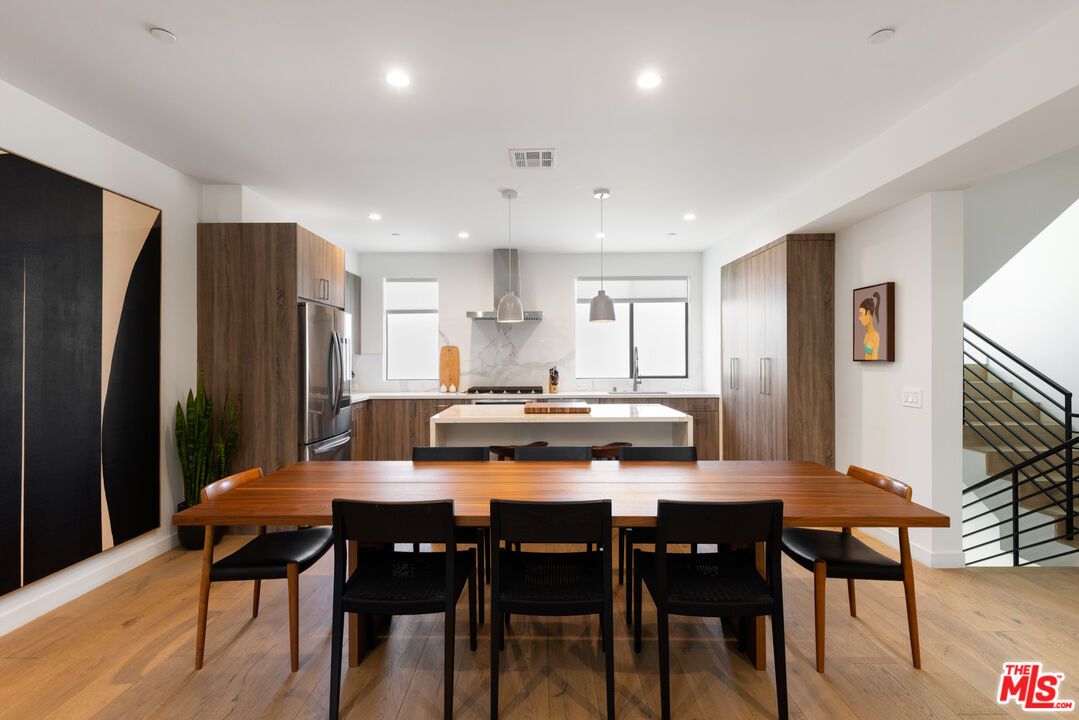Dining room, Interior, Kitchen, Pendant Lights, Recessed Lighting, Stainless Steel Appliances, Wood Texture Flooring