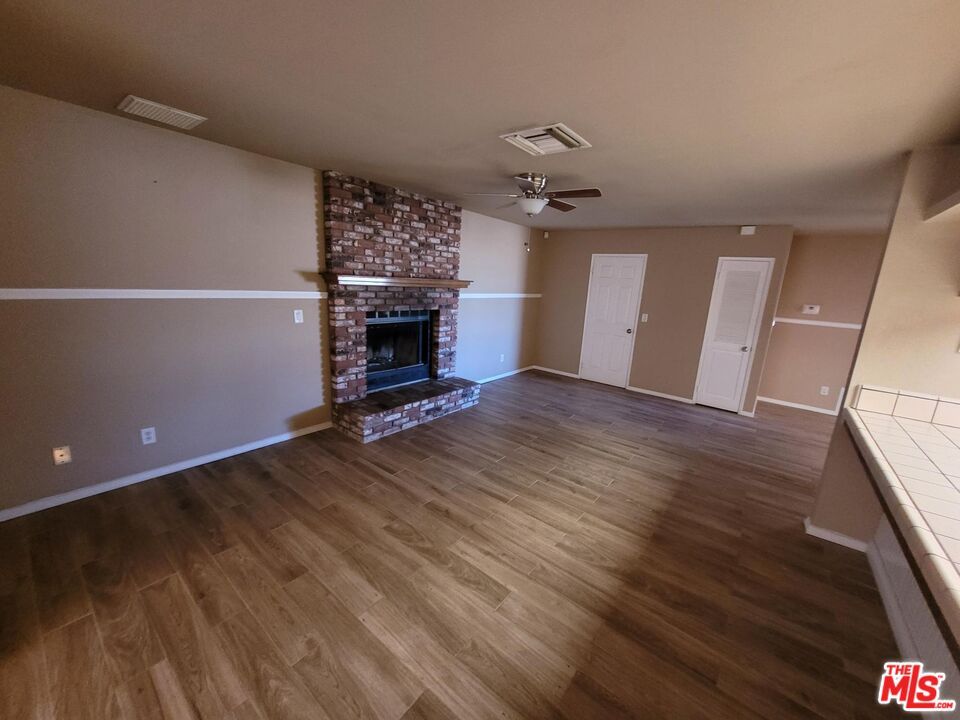 Empty room, Fireplace, Interior, Stone Walls, Wood Texture Flooring