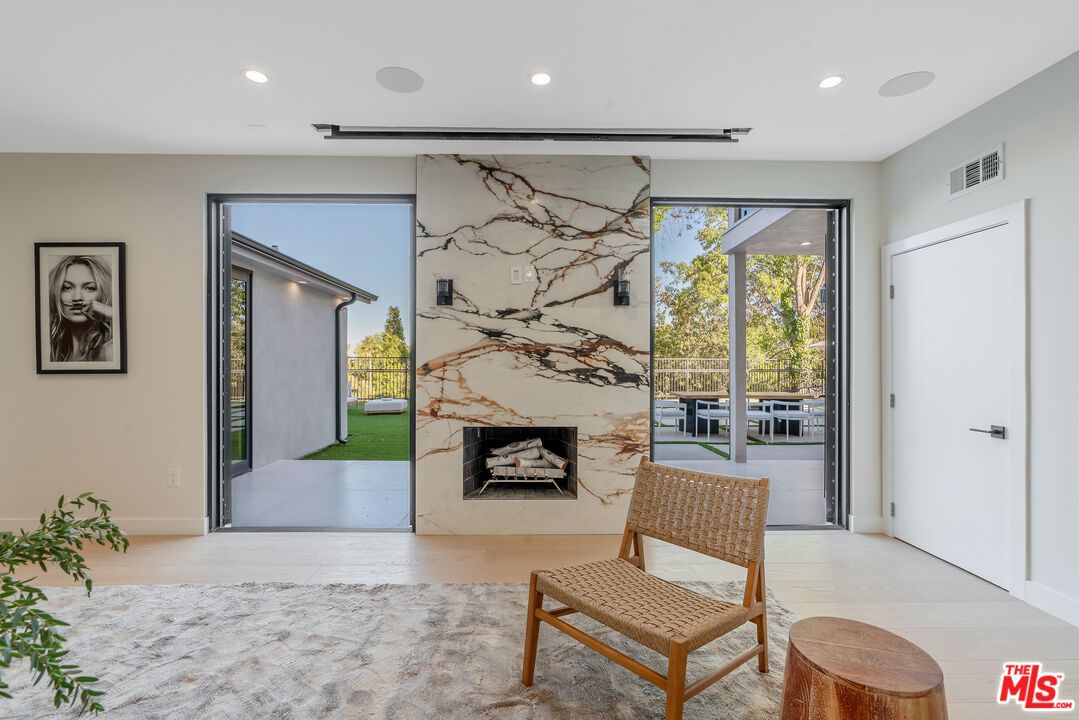 Fireplace, Interior, Marble Walls, Recessed Lighting, Wood Texture Flooring