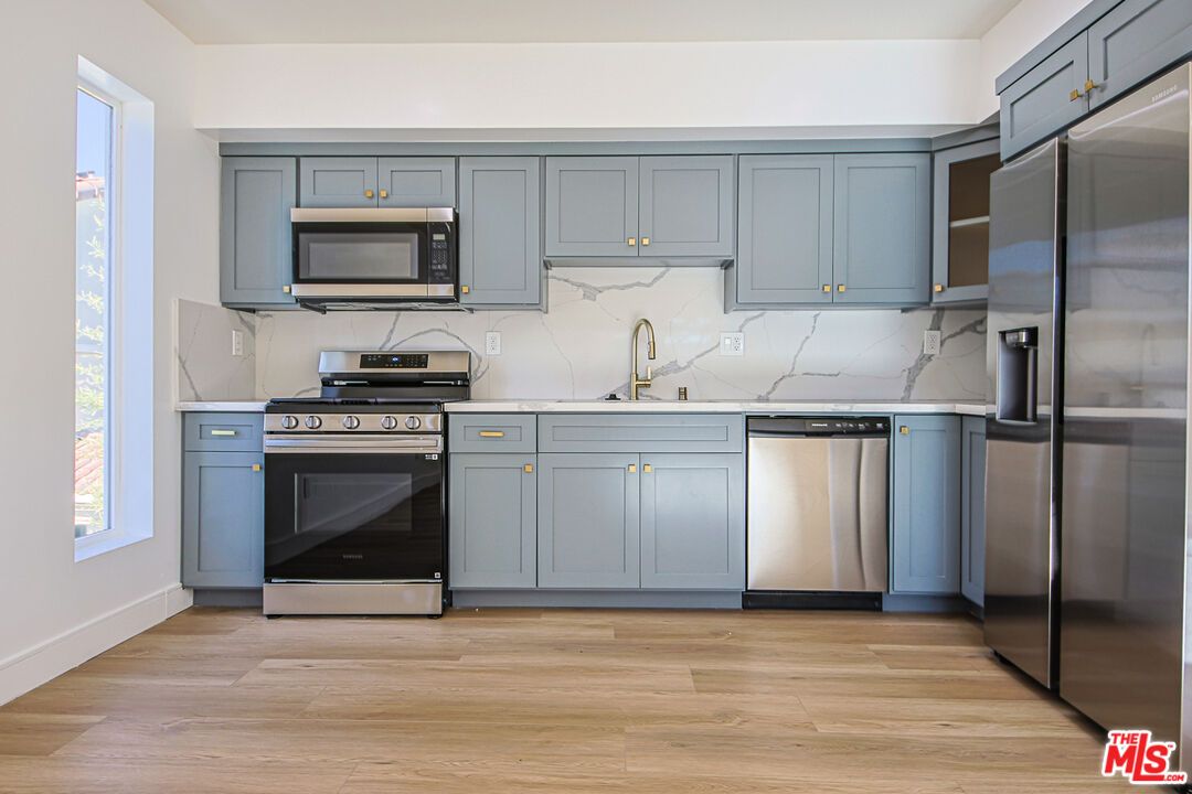 Interior, Kitchen, Marble Walls, Stainless Steel Appliances, Wood Texture Flooring