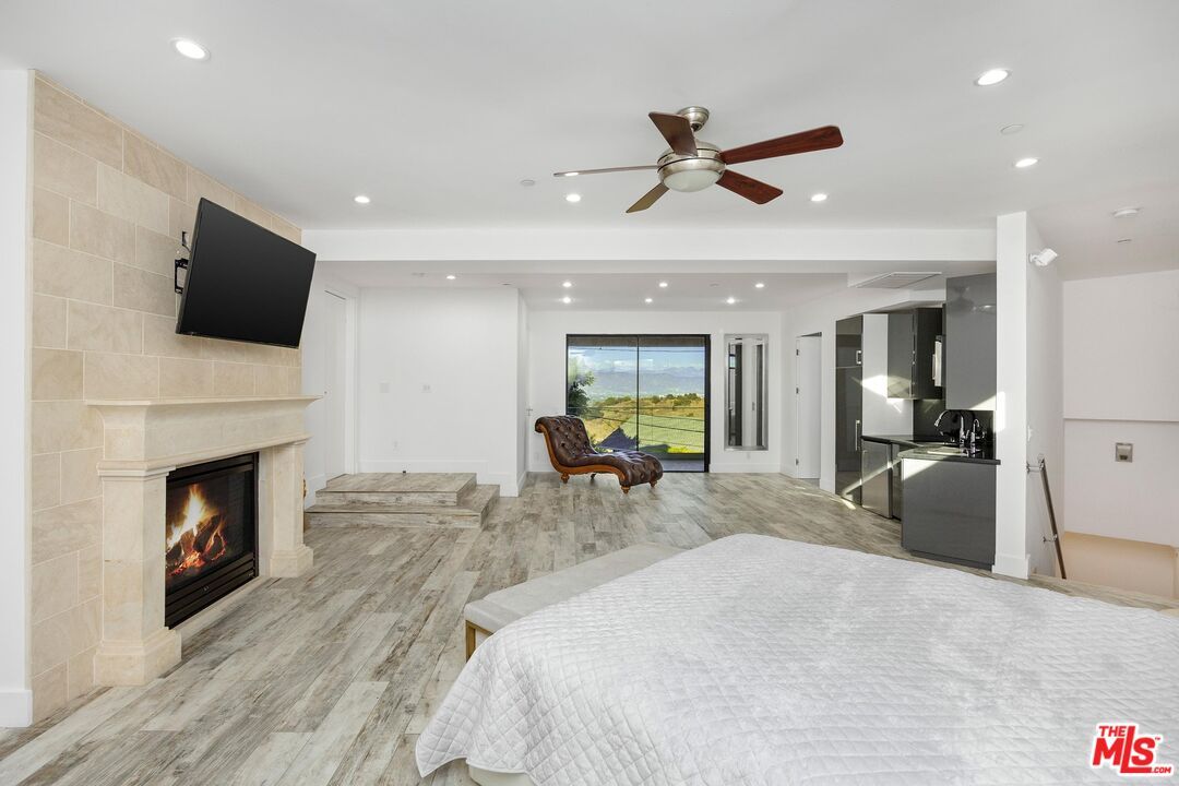 Bedroom, Fireplace, Interior, Recessed Lighting, Wood Texture Flooring