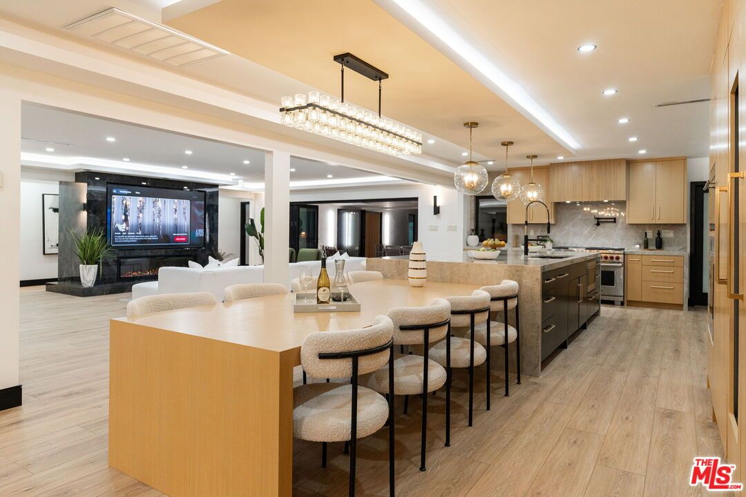 Chandelier, Interior, Kitchen, Living room, Pendant Lights, Recessed Lighting, Stainless Steel Appliances, Wood Texture Flooring