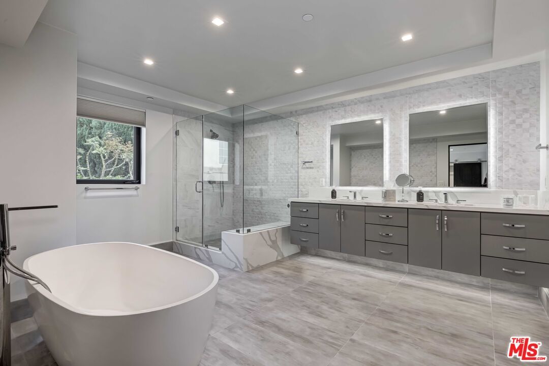 Bathroom, Dual Sink Vanities, Free Standing Baths, Glass Shower, Interior, Marble Walls, Recessed Lighting