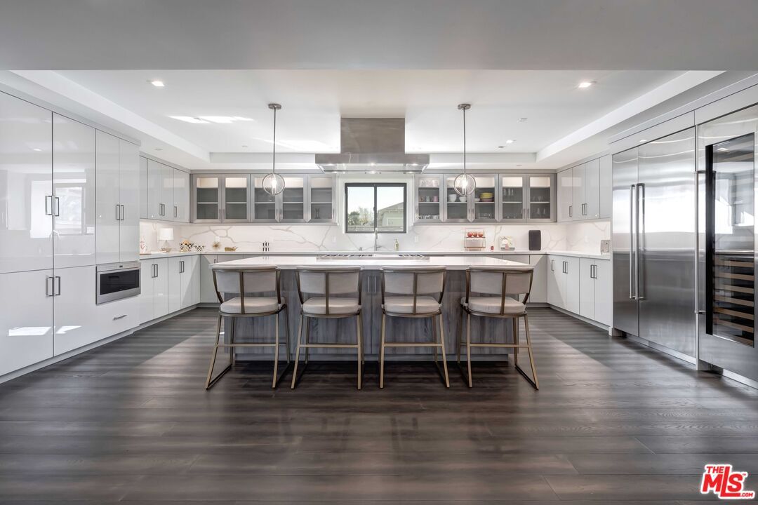 Interior, Kitchen, Marble Walls, Pendant Lights, Recessed Lighting, Stainless Steel Appliances, Wood Texture Flooring