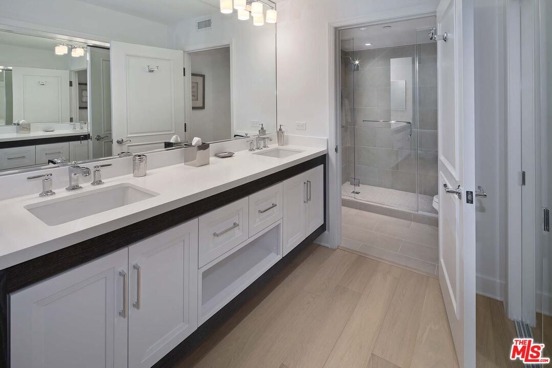 Bathroom, Dual Sink Vanities, Glass Shower, Interior, Wood Texture Flooring