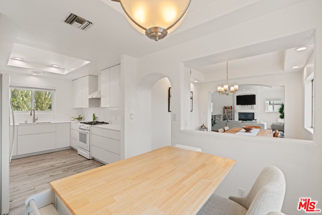 Chandelier, Fireplace, Interior, Kitchen, Living room, Recessed Lighting, Wood Texture Flooring