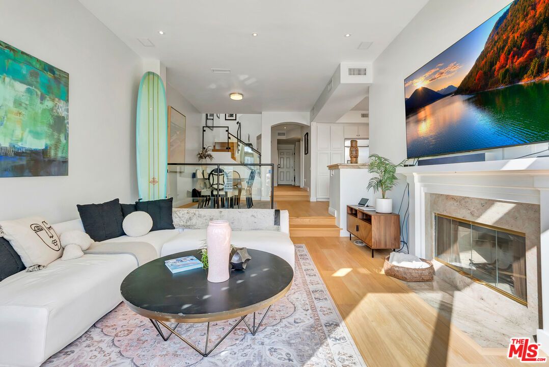 Dining room, Fireplace, Interior, Living room, Recessed Lighting, Wood Texture Flooring