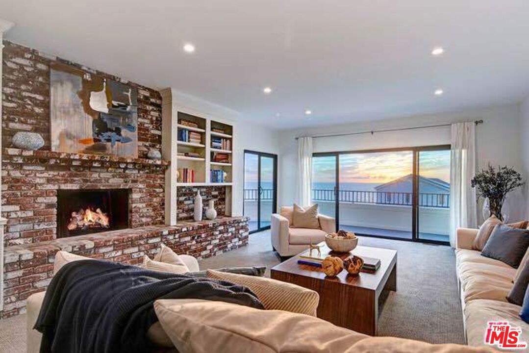 Fireplace, Interior, Living room, Recessed Lighting, Stone Walls, Water