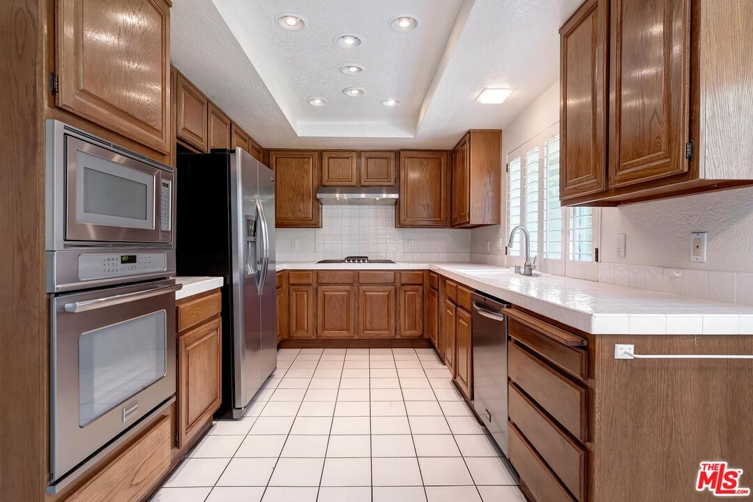 Interior, Kitchen, Recessed Lighting, Stainless Steel Appliances, Tile Countertops