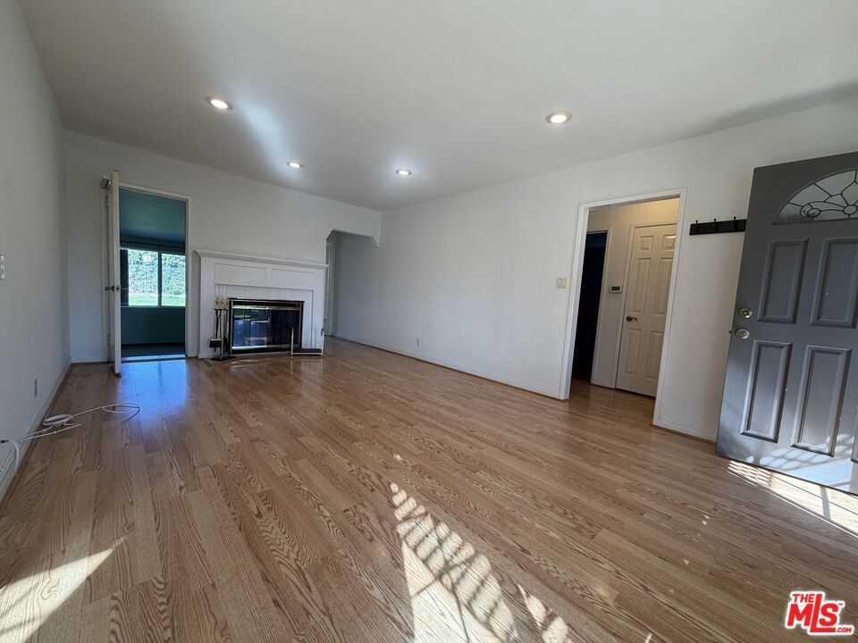 Empty room, Fireplace, Interior, Recessed Lighting, Wood Texture Flooring