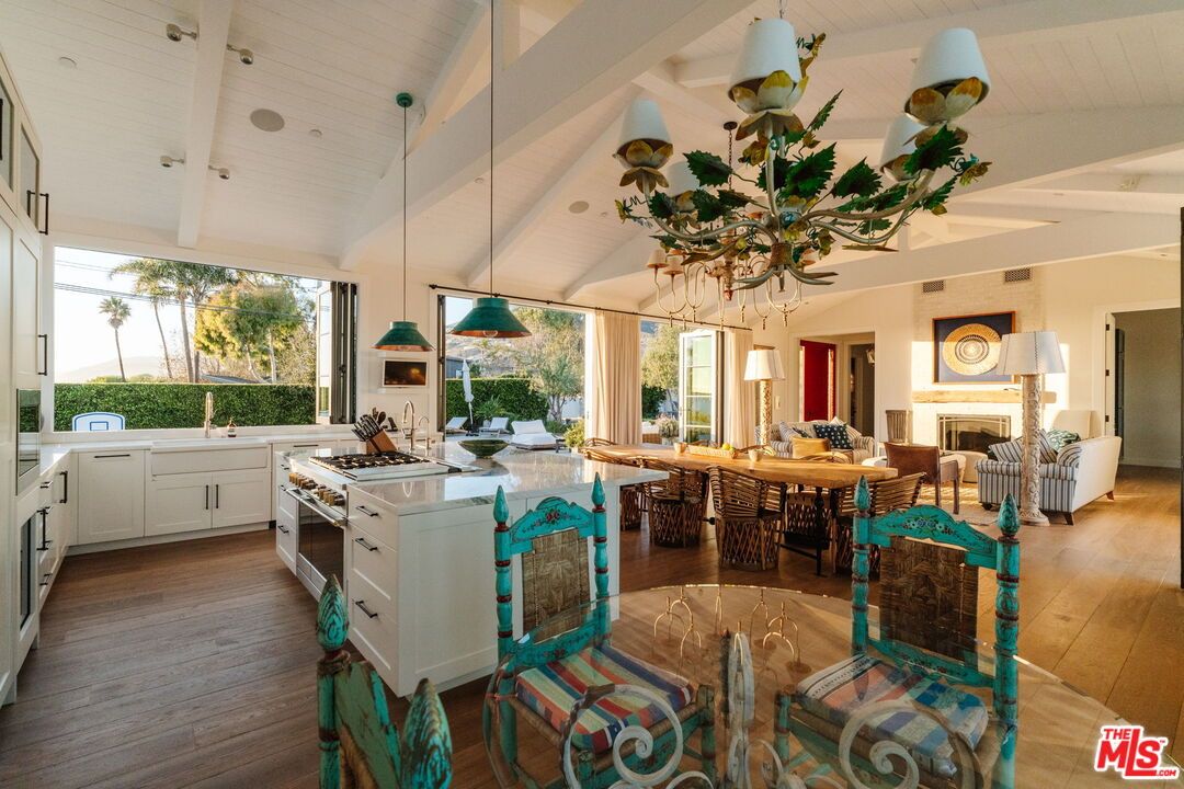 Dining room, Fireplace, Interior, Kitchen, Living room, Pendant Lights, Stainless Steel Appliances, Wood Texture Flooring