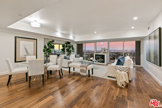 Dining room, Fireplace, Interior, Living room, Recessed Lighting, Wood Texture Flooring