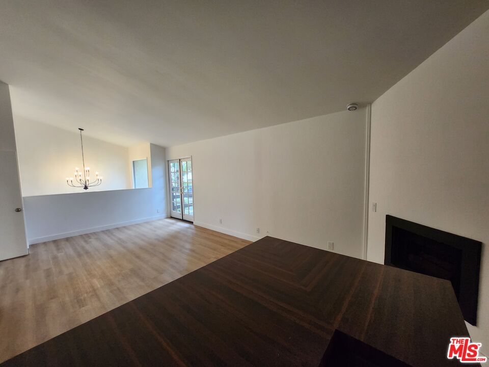Chandelier, Empty room, Fireplace, Interior, Wood Texture Flooring