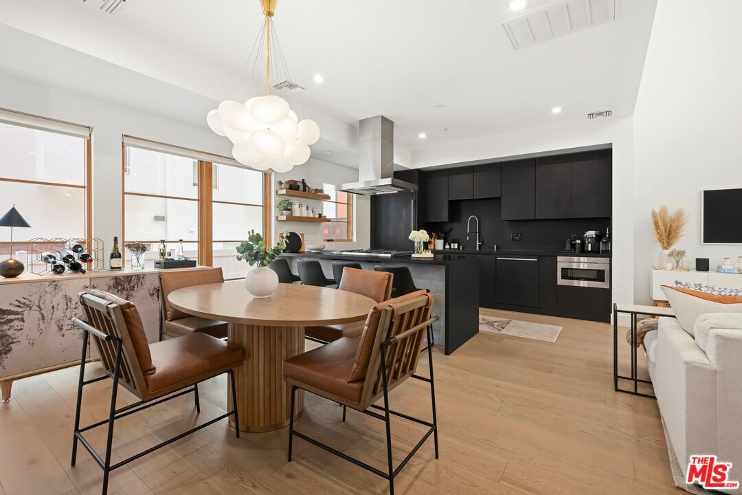 Dining room, Interior, Kitchen, Pendant Lights, Recessed Lighting, Stainless Steel Appliances, Wood Texture Flooring