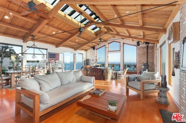 Dining room, Fireplace, Interior, Living room, Pendant Lights, Recessed Lighting, Stone Walls, Water, Wooden Beams, Wooden Ceilings, Wood Texture Flooring