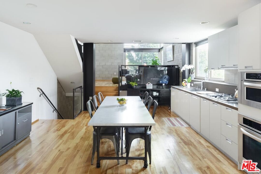 Dining room, Interior, Kitchen, Recessed Lighting, Stainless Steel Appliances, Wood Texture Flooring